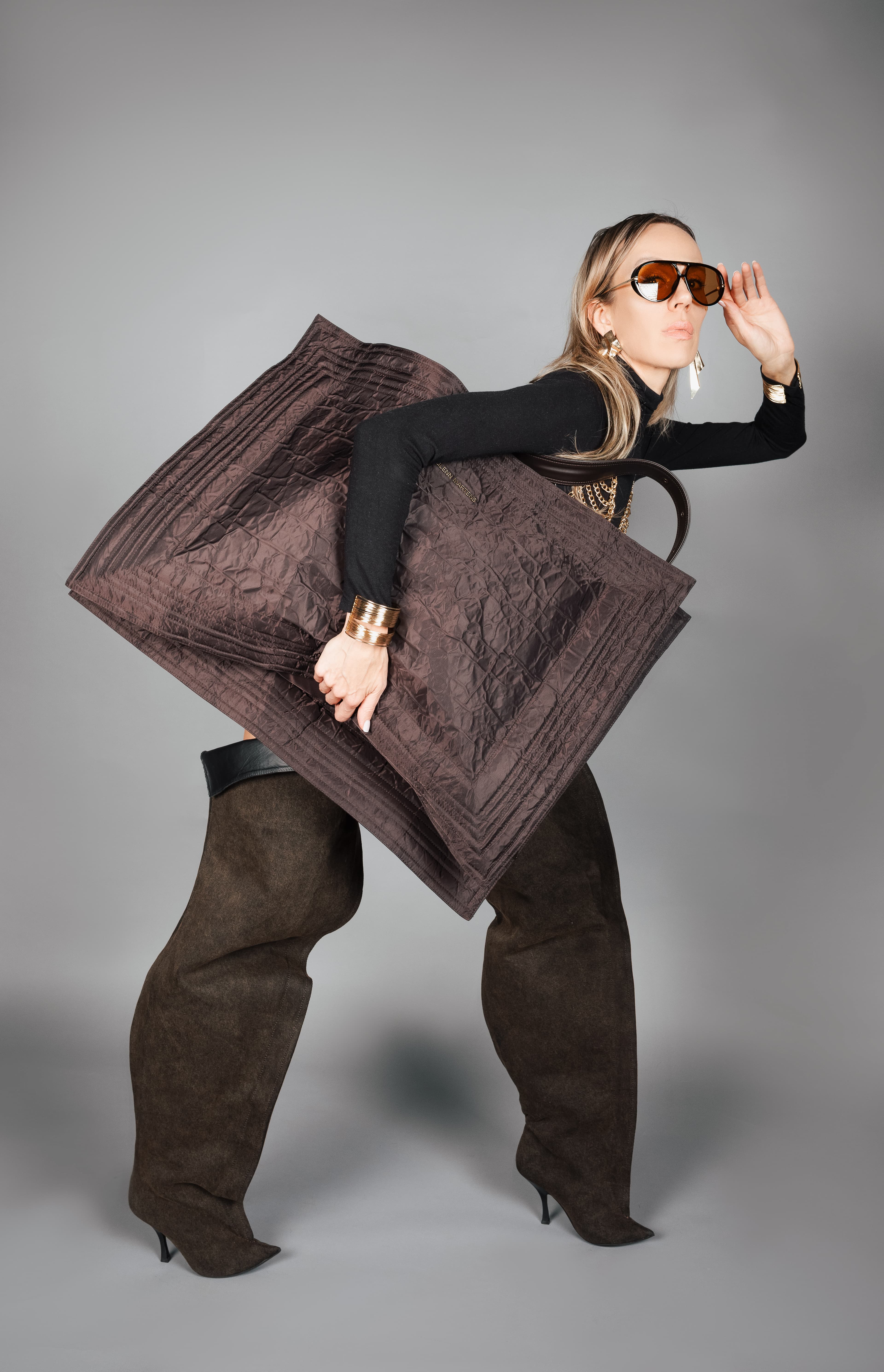 Sofia Solas posing with an oversized black bag